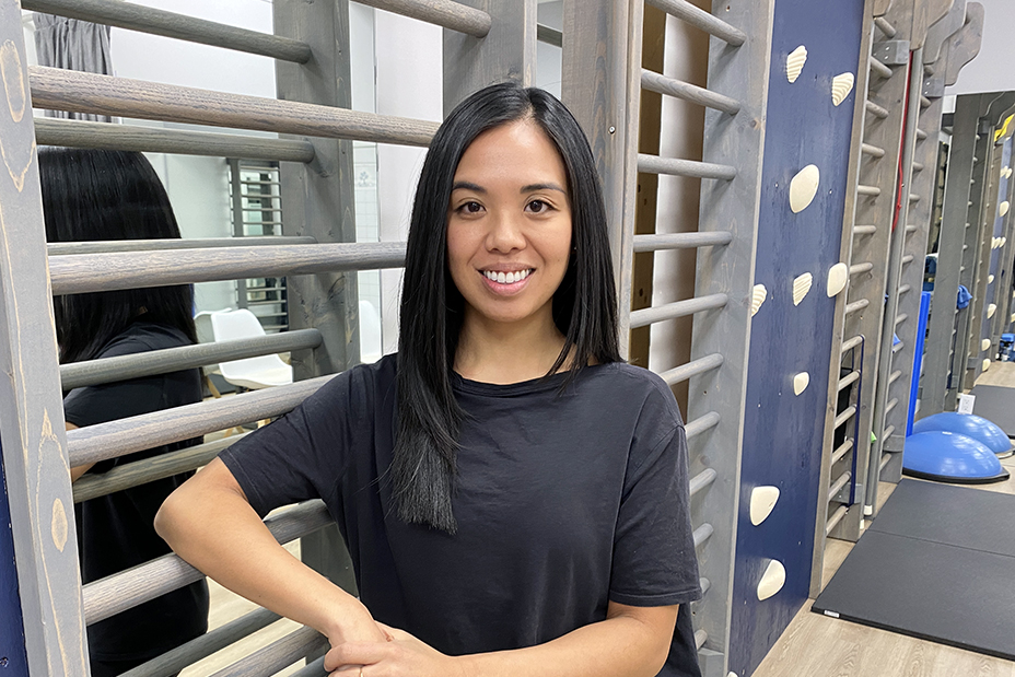 young woman filipina smiling in physiotherapy clinic